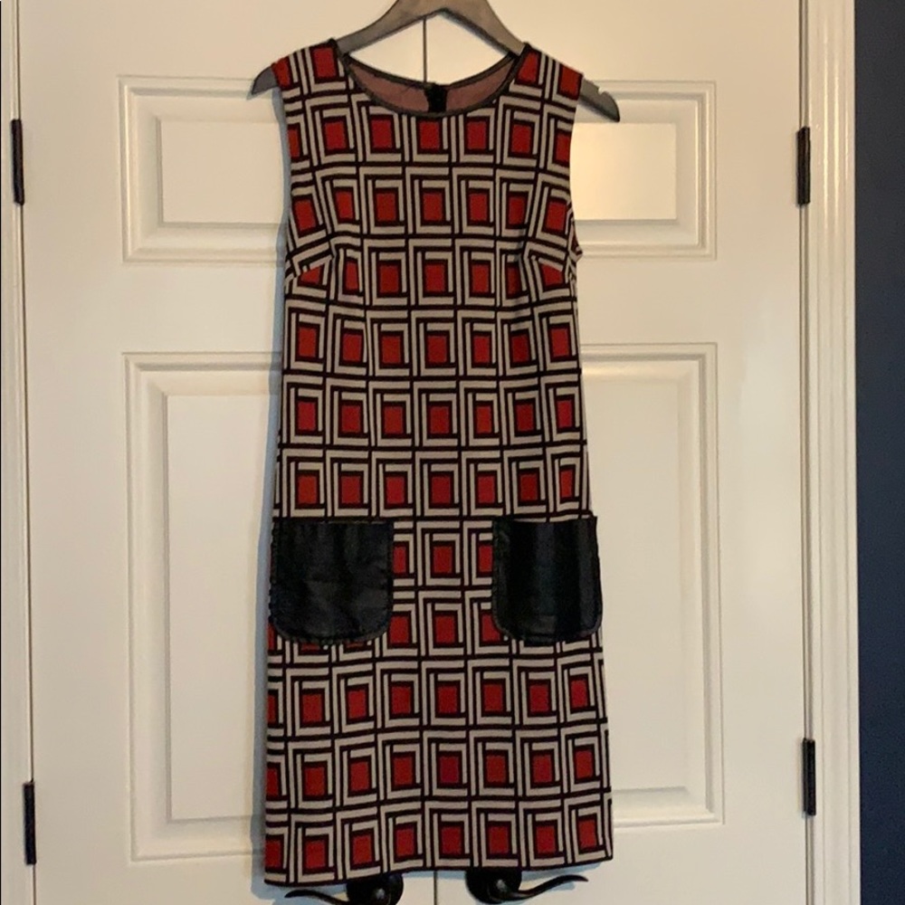 Geometric dress with leather details